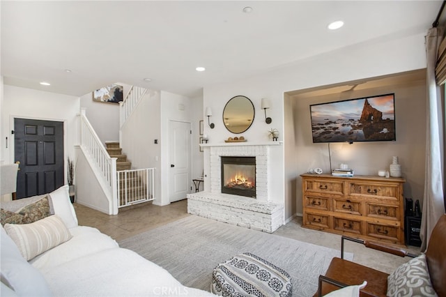 36287 Grazia Way, Winchester, CA 92596 - living area with stairway, a brick fireplace, recessed lighting, and tile patterned floors