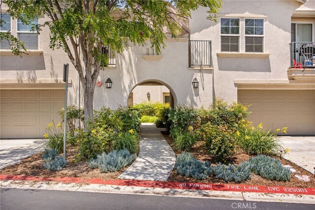 36287 Grazia Way, Winchester, CA 92596 - view of front facade featuring stucco siding, a garage, and driveway