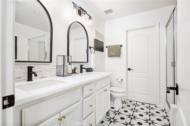 36287 Grazia Way, Winchester, CA 92596 - bathroom with double vanity, an enclosed shower, and decorative backsplash