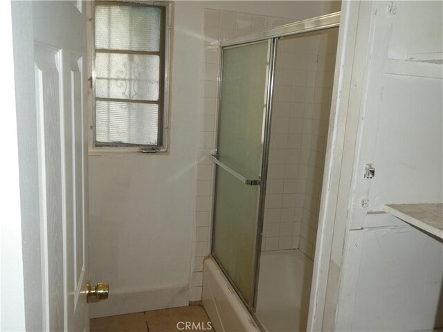 5528 San Onofre Ter, San Diego, CA 92114 - bathroom with enclosed tub / shower combo, tile patterned floors, and vanity
