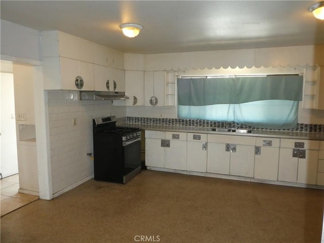 5528 San Onofre Ter, San Diego, CA 92114 - kitchen with gas range, white cabinets, under cabinet range hood, tasteful backsplash, and dark countertops