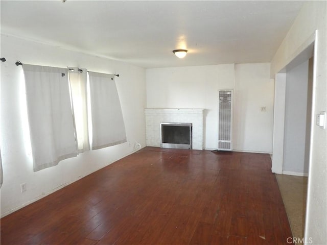 5528 San Onofre Ter, San Diego, CA 92114 - unfurnished living room featuring a heating unit, wood-type flooring, and a fireplace