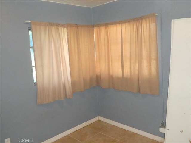 5528 San Onofre Ter, San Diego, CA 92114 - spare room featuring baseboards and tile patterned flooring