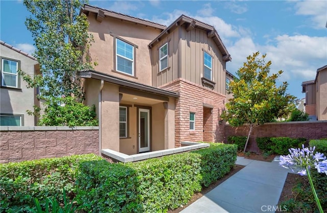 8708 Celebration St, Chino, CA 91708 - view of front of house with board and batten siding and stucco siding