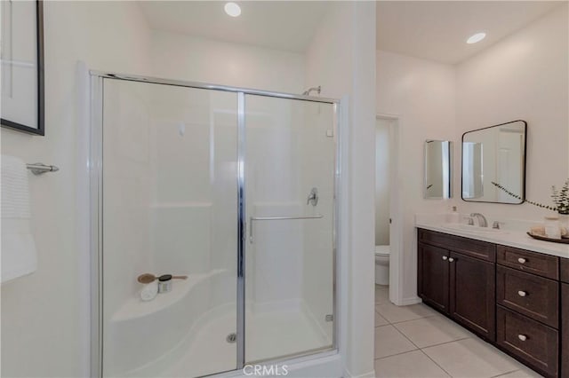 8708 Celebration St, Chino, CA 91708 - bathroom featuring a stall shower, tile patterned floors, and vanity