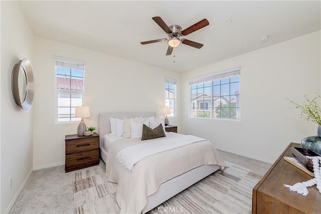 8708 Celebration St, Chino, CA 91708 - carpeted bedroom with multiple windows and ceiling fan