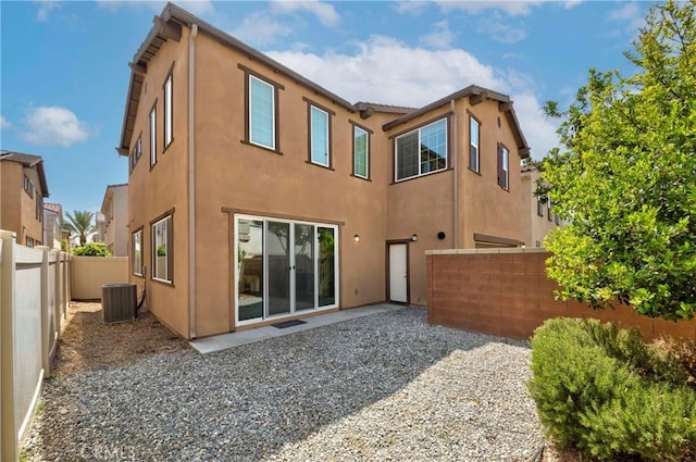 8708 Celebration St, Chino, CA 91708 - back of property with stucco siding, a fenced backyard, and a patio area