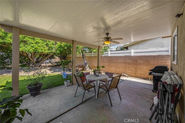 1344 S Douglas St, Santa Ana, CA 92704 - fenced backyard with outdoor dining area, a patio area, a ceiling fan, and grilling area
