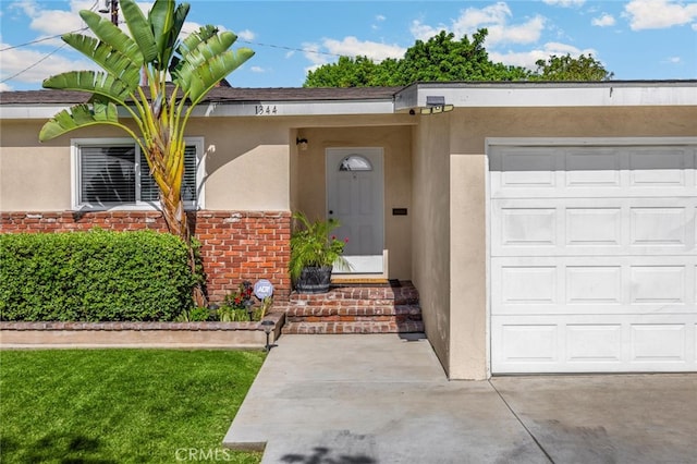 1344 S Douglas St, Santa Ana, CA 92704 - property entrance featuring stucco siding, concrete driveway, and an attached garage