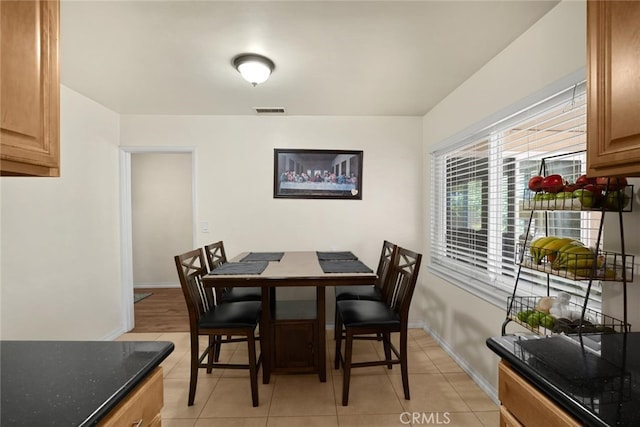 1344 S Douglas St, Santa Ana, CA 92704 - dining space featuring light tile patterned floors