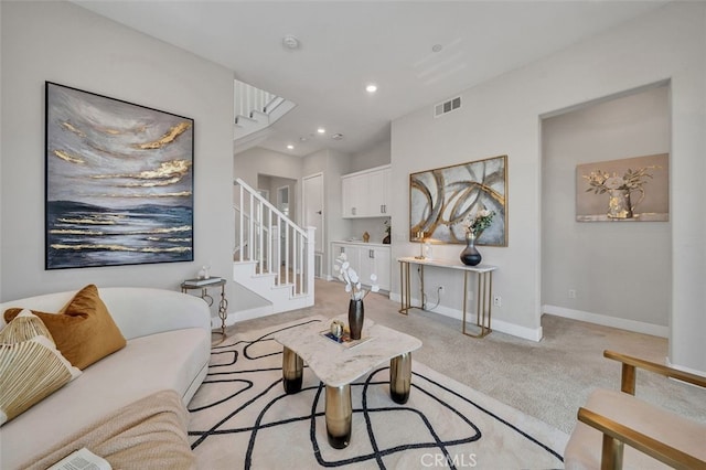 319 Sawbuck, Irvine, CA 92618 - living room with stairway, light colored carpet, and recessed lighting