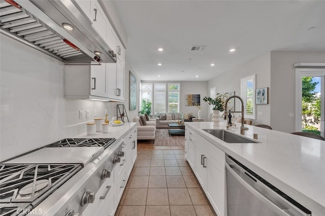 319 Sawbuck, Irvine, CA 92618 - kitchen with premium range hood, appliances with stainless steel finishes, recessed lighting, plenty of natural light, and light countertops