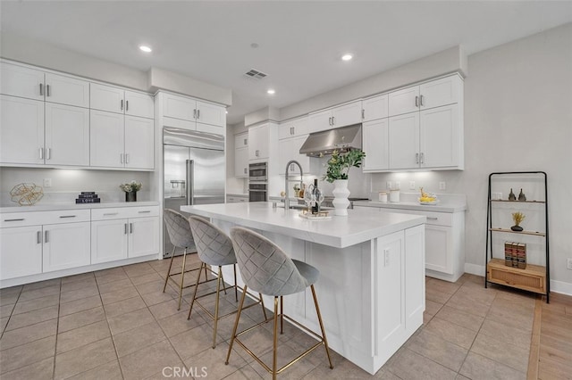 319 Sawbuck, Irvine, CA 92618 - kitchen with built in fridge, light tile patterned floors, light countertops, white cabinetry, and recessed lighting