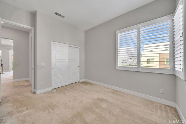 319 Sawbuck, Irvine, CA 92618 - unfurnished bedroom with light colored carpet and a closet