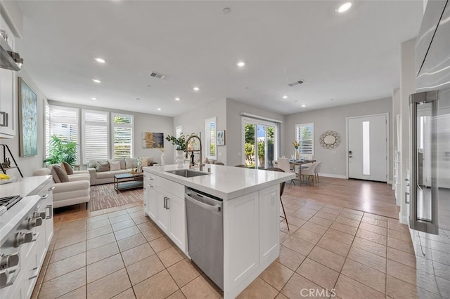 319 Sawbuck, Irvine, CA 92618 - kitchen with stainless steel appliances, light tile patterned floors, open floor plan, recessed lighting, and light countertops