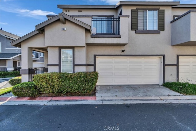 3434 E Lambeth Ct Unit F, Orange, CA 92869 - multi unit property with a garage, stucco siding, and driveway