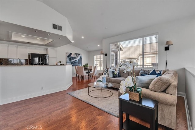 3434 E Lambeth Ct Unit F, Orange, CA 92869 - living area with plenty of natural light, wood finished floors, recessed lighting, and lofted ceiling