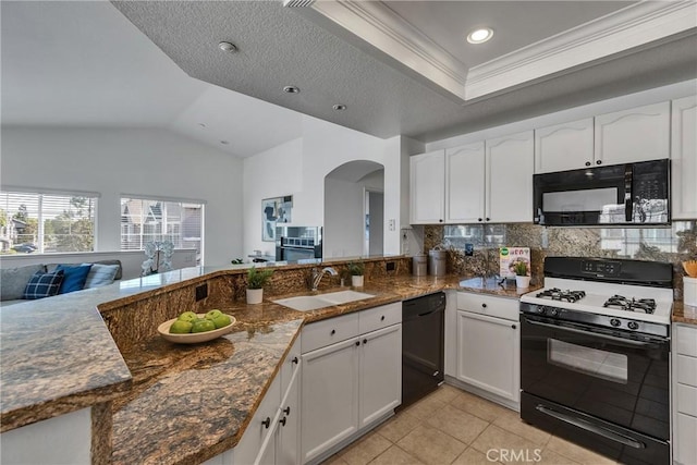 3434 E Lambeth Ct Unit F, Orange, CA 92869 - kitchen with black appliances, white cabinets, arched walkways, light tile patterned floors, and decorative backsplash