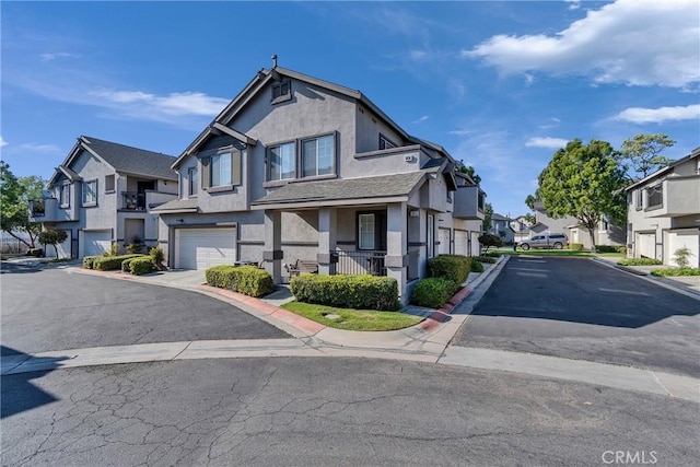 3434 E Lambeth Ct Unit F, Orange, CA 92869 - view of front facade with a residential view, stucco siding, and a garage