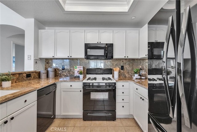 3434 E Lambeth Ct Unit F, Orange, CA 92869 - kitchen featuring black appliances, arched walkways, light stone counters, white cabinets, and crown molding