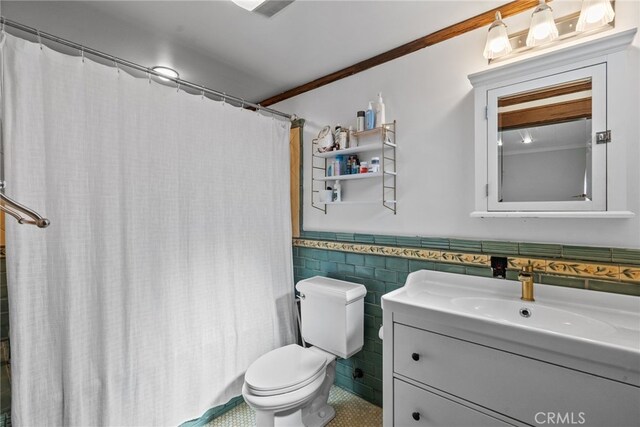 1719 Monte Vista St, Pasadena, CA 91106 - bathroom featuring vanity, tile walls, a wainscoted wall, tile patterned floors, and a shower with curtain