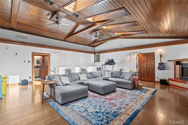 1719 Monte Vista St, Pasadena, CA 91106 - living room featuring ceiling fan, wood ceiling, a skylight, wood finished floors, and a tiled fireplace