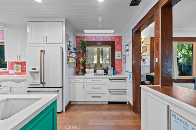 1719 Monte Vista St, Pasadena, CA 91106 - kitchen featuring high end fridge, white cabinetry, light wood finished floors, and recessed lighting