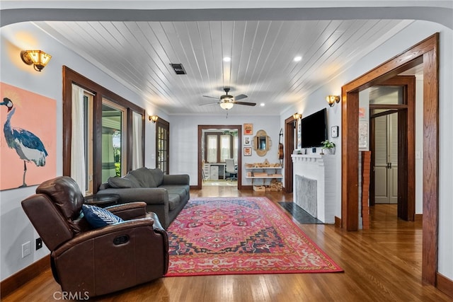 1719 Monte Vista St, Pasadena, CA 91106 - living area featuring arched walkways, wood finished floors, recessed lighting, a brick fireplace, and ceiling fan