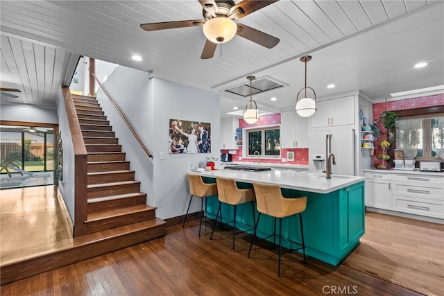 1719 Monte Vista St, Pasadena, CA 91106 - kitchen featuring a ceiling fan, wood finished floors, white cabinets, light countertops, and white refrigerator with ice dispenser