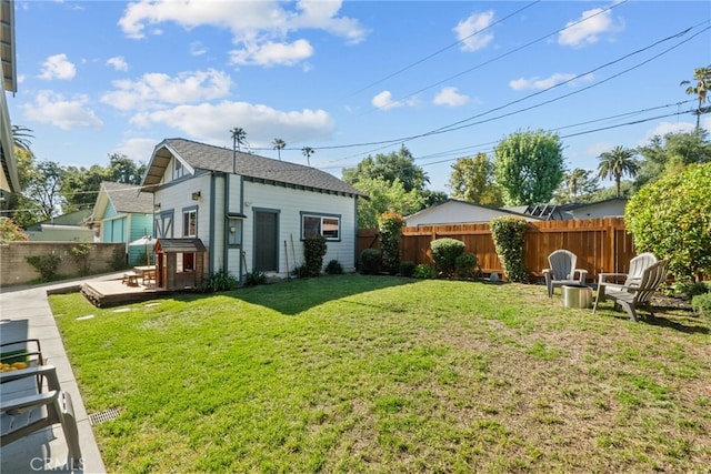 1719 Monte Vista St, Pasadena, CA 91106 - rear view of house featuring a fenced backyard, a deck, and an outdoor structure