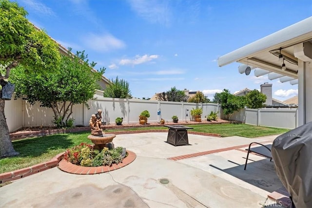 5129 W Pinehurst Dr, Banning, CA 92220 - fenced backyard with a fire pit, a patio area, and grilling area