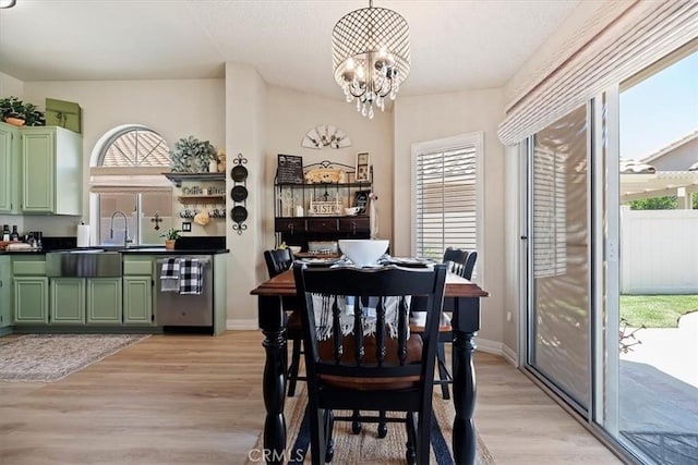 5129 W Pinehurst Dr, Banning, CA 92220 - dining area featuring healthy amount of natural light, light wood finished floors, and a chandelier