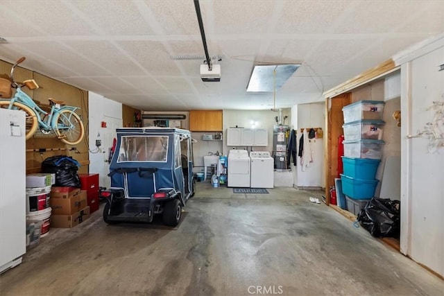 5129 W Pinehurst Dr, Banning, CA 92220 - garage with water heater, washing machine and clothes dryer, and a garage door opener