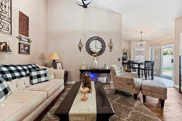 5129 W Pinehurst Dr, Banning, CA 92220 - living area with a chandelier, wood finished floors, and a textured ceiling