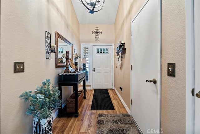 5129 W Pinehurst Dr, Banning, CA 92220 - entrance foyer featuring wood finished floors and a textured wall