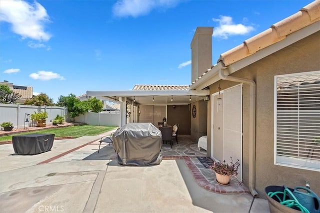 5129 W Pinehurst Dr, Banning, CA 92220 - fenced backyard featuring a patio area, area for grilling, and outdoor dining area