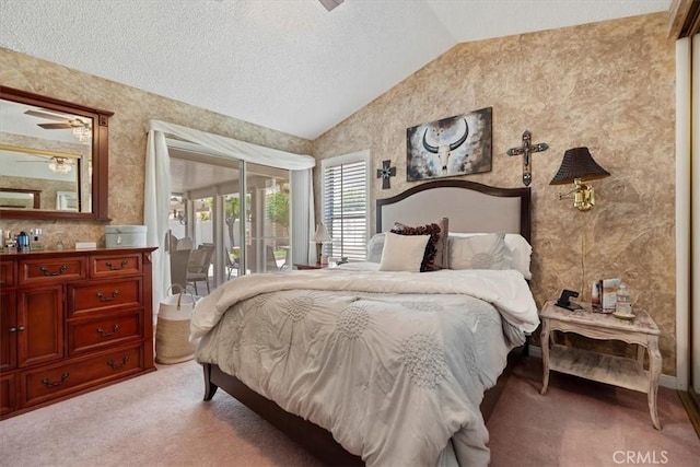 5129 W Pinehurst Dr, Banning, CA 92220 - carpeted bedroom featuring access to exterior, lofted ceiling, a textured ceiling, and wallpapered walls