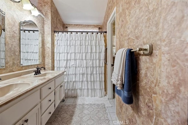 5129 W Pinehurst Dr, Banning, CA 92220 - full bathroom with tile patterned flooring, double vanity, and a shower with curtain