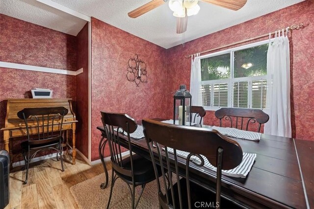 5129 W Pinehurst Dr, Banning, CA 92220 - dining room featuring wood finished floors, ceiling fan, and a textured ceiling