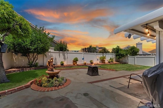 5129 W Pinehurst Dr, Banning, CA 92220 - fenced backyard with an outdoor fire pit, a patio, and area for grilling