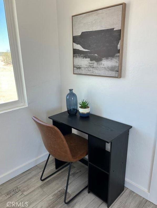 55354 El Lobo Rd, Landers, CA 92285 - office space featuring light wood-style flooring and baseboards