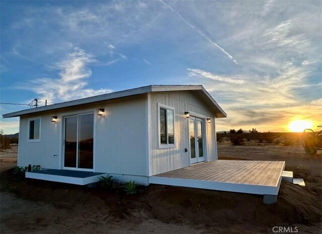 55354 El Lobo Rd, Landers, CA 92285 - back of house featuring a wooden deck and french doors
