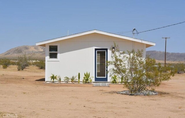 55354 El Lobo Rd, Landers, CA 92285 - back of house featuring a mountain view