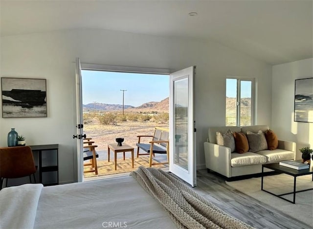 55354 El Lobo Rd, Landers, CA 92285 - bedroom with lofted ceiling, a mountain view, wood finished floors, and access to outside