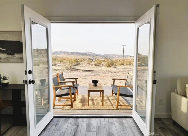 55354 El Lobo Rd, Landers, CA 92285 - doorway to outside featuring a mountain view, french doors, and wood finished floors