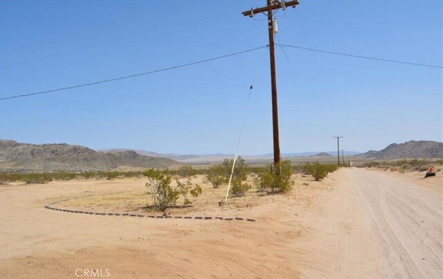 55354 El Lobo Rd, Landers, CA 92285 - view of dirt / gravel road with a mountain view and a rural view
