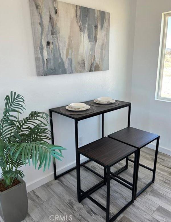 55354 El Lobo Rd, Landers, CA 92285 - dining space featuring wood finished floors and baseboards