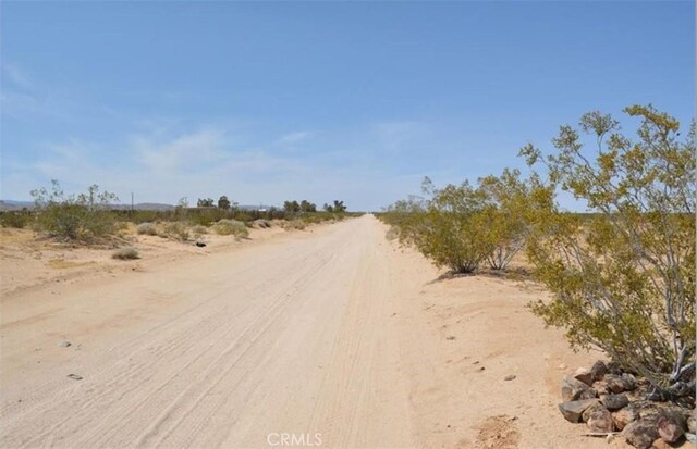 55354 El Lobo Rd, Landers, CA 92285 - view of dirt / gravel road featuring a view of countryside