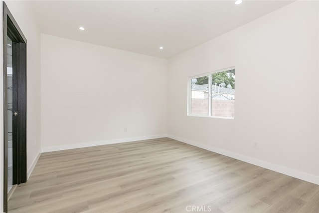 15009 Wyandotte St, Van Nuys, CA 91405 - empty room featuring light wood-style floors and recessed lighting