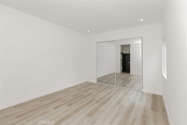 15009 Wyandotte St, Van Nuys, CA 91405 - unfurnished bedroom featuring a closet, light wood finished floors, and recessed lighting